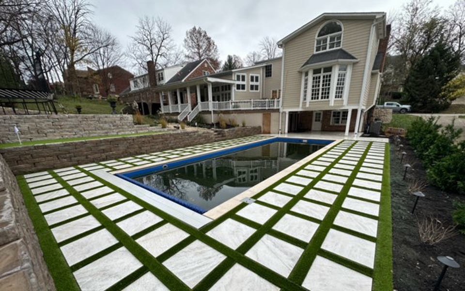 Pool with pavers and grass Photo